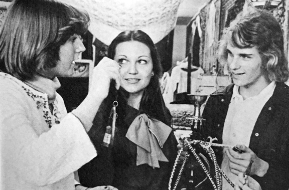 Karen Horn, Darla Grob, and John Taylor shopping at Asylum Imports.