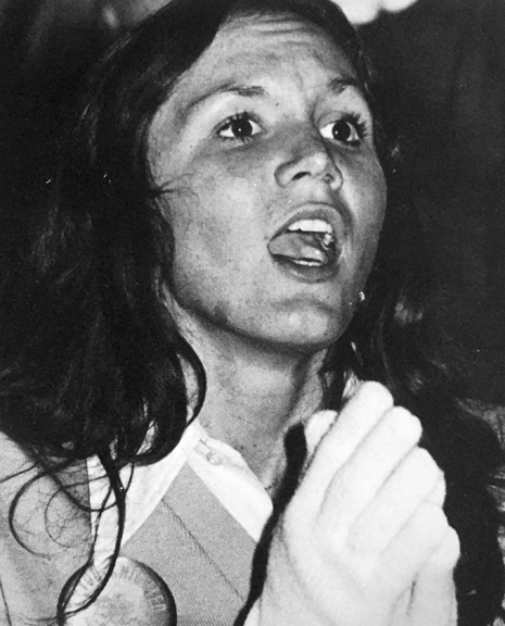 Becky Simon shouts out support during a football game.