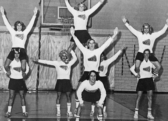"THAT'S the senior battle cry!" Super cheerleaders Mike McCain, DeWayne Vaughn, Robert Luna, Doug Stewart, Bent Milburn, Chuck Linhardt, Kurt Myers, Kimbo Gerlich and Randy Compton entertain the crowd at a pep assembly.