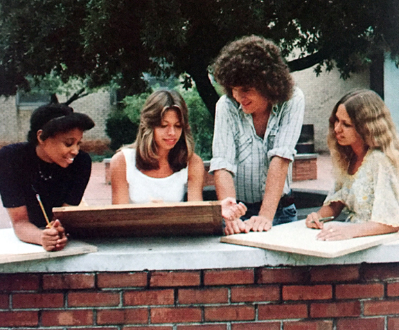 COOLING OFF... Spring's first warm days draw art students, April Hildreth, Joan Goe, Cam Eagle and Doreen Snyder, out to the patio to sketch.